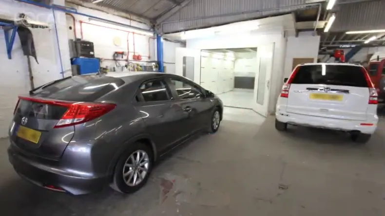 image of 2 cars being repaired in sheffield at John Bee Ltd